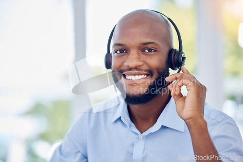 Image of Black man, portrait and callcenter with phone call and contact us, communication with headset and CRM. Male consultant with smile, customer service or telemarketing with tech support and help desk