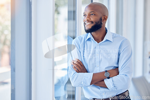 Image of Black man in business, arms crossed and thinking, professional mindset and mission with view out the window. Career success, vision and happy male person with corporate future and company growth