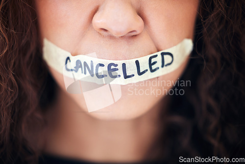 Image of Political, protest and closeup with tape on a mouth for justice, freedom or revolution movement. Bullying, violence and zoom of a woman with cancelled on lips for feminism, activism or discrimination