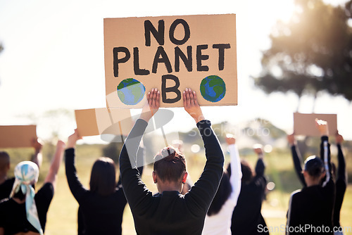 Image of Protest, climate change and sign with a group of people outdoor at a rally or march for conservation. Global warming, poster and environment with a crowd walking together during a community strike