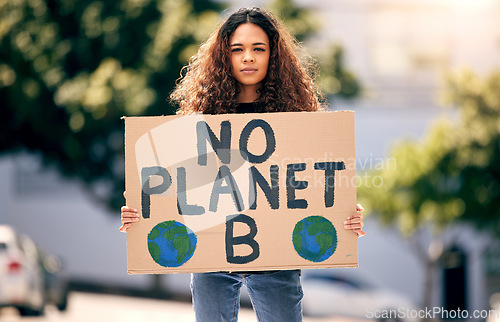 Image of Woman, poster and portrait in street for planet, climate change and sustainable future in city. Girl, cardboard sign and activism for change, sustainability and justice for environment in metro road