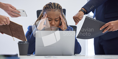 Image of Headache, business and overwhelmed black woman surrounded in busy office with stress, paperwork and laptop. Frustrated, overworked and tired employee with anxiety from deadline time pressure crisis.