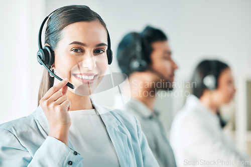 Image of Young woman, call center and microphone in portrait with smile, consulting and customer service agency. Girl, telemarketing agent and pride for job, contact us or happy at technical support help desk