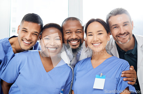 Image of Medical, portrait of doctors and happy together at hospital or clinic with smile. Diversity, medical team for healthcare and excited or cheerful group of nurse or surgeons smiling for health wellness