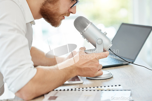 Image of Podcast, talking and business man on microphone of career advice, news broadcast or web platform in office. Live streaming, computer and person speaking, voice and politics or radio discussion on mic