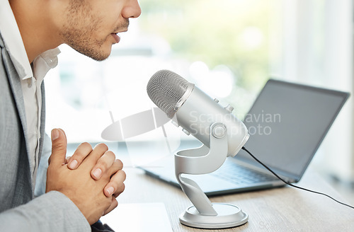 Image of Podcast, microphone and business man speaking, advice or online broadcast on web 3.0 platform, laptop and office. Serious influencer person, voice, sound and talking news, politics or media on radio