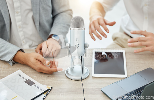 Image of Podcast, interview and business people hands, microphone and broadcast, talking or news, finance and advice in office. Radio, live streaming and professional person, partner or startup team planning