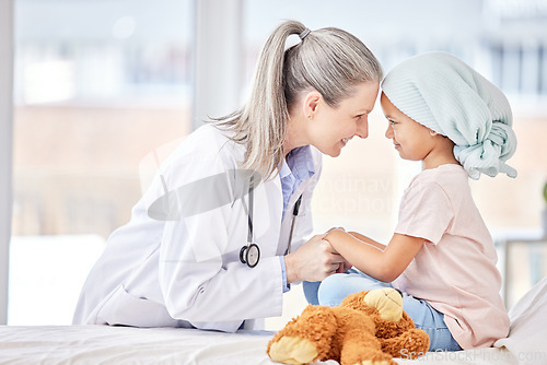 Image of Cancer patient, child and doctor holding hands for support, healthcare courage or empathy, love and healing in hospital bed. Happy girl or sick kid and pediatrician or medical person helping together