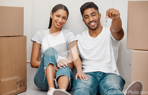 Image of Box, key and portrait of couple in new home excited for property, apartment and real estate investment, Relationship, house and man and woman with housekeys, boxes and happy on moving day with boxes