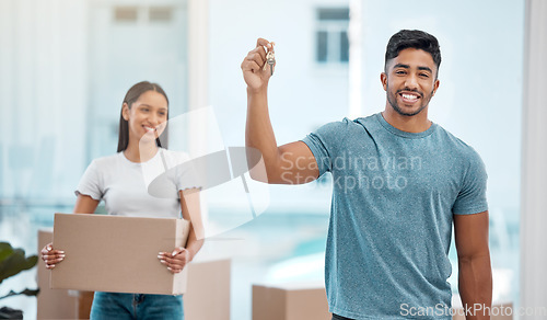 Image of Box, key and portrait of couple in new house excited for property, apartment and real estate investment. Relationship, moving day and man and woman with keys carry boxes for relocation, move and home