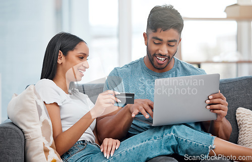 Image of Online shopping, laptop and credit card, couple on sofa in living room and internet banking in home. Technology, ecommerce payment and happy woman and man browsing retail website or digital shop deal