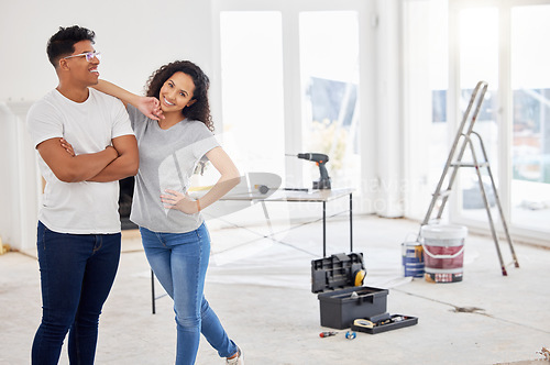 Image of Maintenance, renovation and portrait with a couple in their new home together for a remodeling project. Construction, real estate or diy property improvement with a man and woman bonding in a house