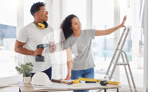 Image of Maintenance, renovation and planning with a couple in the new home together for a remodeling project. Construction, real estate or property vision with a man and woman bonding over house maintenance