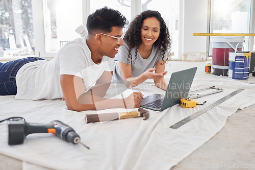 Image of Laptop, renovation and diy planning with a couple in their new house together for remodeling design. Construction, real estate or property improvement with a man and woman discussing a home project