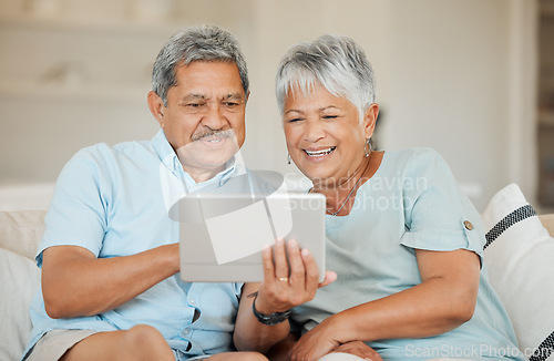 Image of Technology, senior and couple with tablet happy on sofa in living room of their home. Connectivity or social networking, cheerful and smile with married people on couch streaming movie for retirement