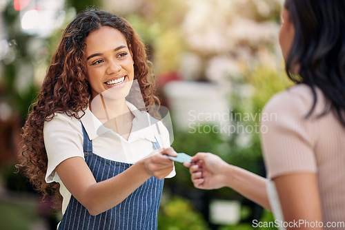 Image of Woman waiter, credit card and payment at a coffee shop with barista and smile outdoor. Purchase, working and shopping with customer service and a female retail worker with happiness from cafe pay