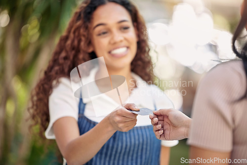 Image of Woman waiter, hands and credit card payment at a coffee shop with barista and smile outdoor. Purchase, working and shopping with customer service and female retail worker with happiness from cafe