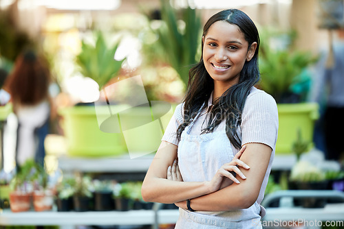 Image of Smile, arms crossed and portrait of woman in garden or nursery as a business owner or employee. Spring, plant expert and a worker at an ecology shop in a park with mockup space for retail or service