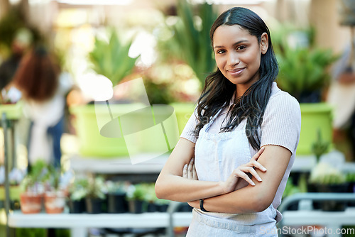 Image of Happy, pride and portrait of a woman in a garden or nursery as a business owner or employee. Smile, plant expert and a worker at an ecology shop in a park with mockup space for retail or service