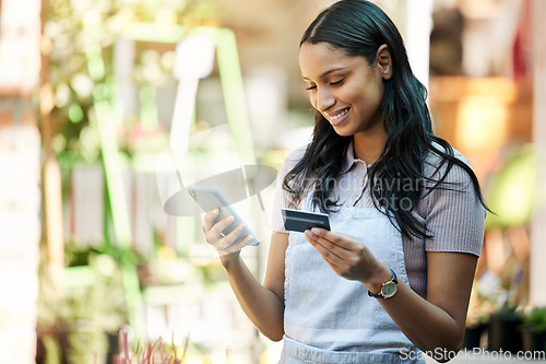 Image of Woman, credit card and business owner with ecommerce, online shopping and digital payment. Outdoor, banking app and female employee with a smile with mobile connectivity on web for purchase at cafe