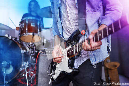 Image of Guitar, band and man hands at music festival show playing rock with electric instrument with lights. Sound, musician and party with live talent and audio for punk event with people at a concert