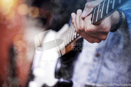 Image of Guitar, rock and man hands at music festival show playing band with electric instrument with lights. Sound, musician and party with live talent and audio for punk event with people at a concert