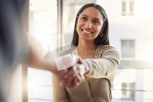 Image of Handshake, thank you and agreement with a business woman and colleague in an office for a meeting. Partnership, collaboration and trust with people shaking hands together in a corporate workplace