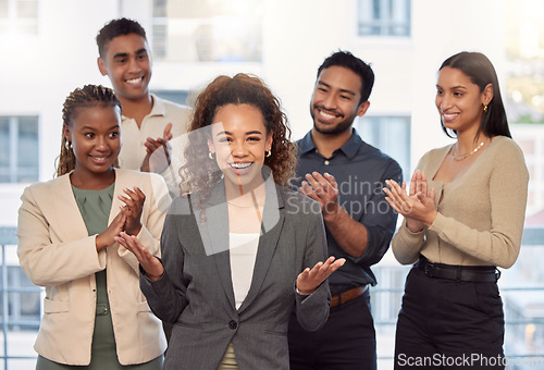 Image of Portrait, support and applause with a business team clapping for the achievement of a woman colleague in the office. Wow, win and motivation with a group of employees cheering for a female colleague