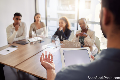 Image of Meeting, presentation and a business man with a tablet in the boardroom, talking to his team of colleagues. Workshop, coaching and teaching with a male manager in the office during a training seminar