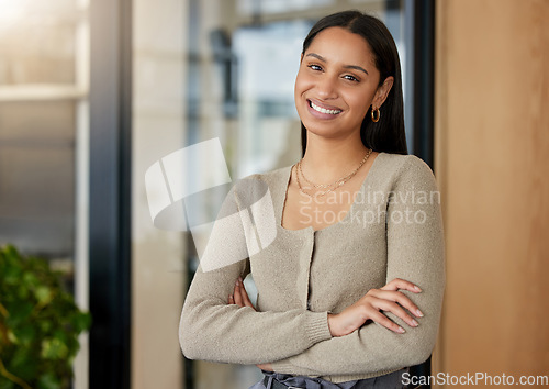 Image of Portrait, arms crossed and business woman, designer or professional in office workplace. Face, creative and smile of female entrepreneur or confident design person from India with pride for career.