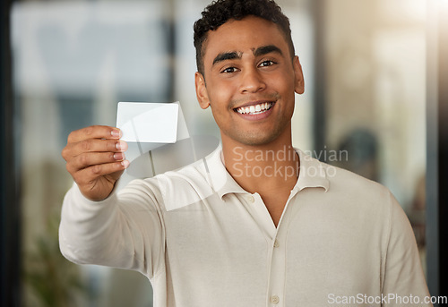 Image of Portrait of happy man showing business card, networking and branding info for company in modern office. Business man with smile, blank white company info and professional information exchange at work