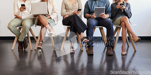 Image of Technology, legs and people waiting for an interview in line at a human resources office as candidates for a vacancy. We are hiring, recruitment and opportunity with man and woman employees online