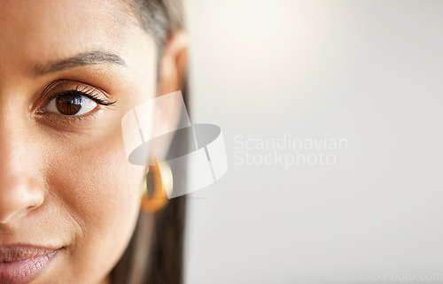 Image of Woman, eye and face portrait with space for mockup, advertising or vision on a studio background. Zoom and half headshot of a female person or student with natural beauty, focus and concentration