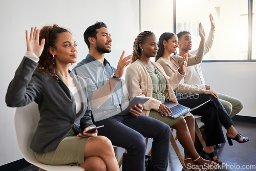 Image of Seminar, workshop and business people in an office with questions in training at work. Happy, team and group of employees sitting in a line at an agency with a vote, volunteering or recruitment