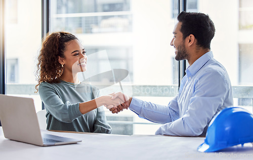 Image of Engineering, handshake and woman with partner for construction planning, thank you and success or deal in office. B2b, onboarding and architecture meeting of contractor or happy people shaking hands