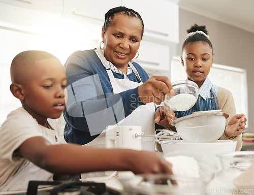 Image of Black family, grandmother teaching kids baking and learning cooking skill in kitchen with help and support. Old woman with girl and boy, development with growth and bake with ingredients at home