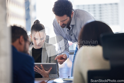 Image of Digital tablet, discussion and business people doing research together in a meeting in the office. Technology, professional and corporate team working on a project in collaboration in the boardroom.