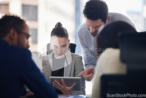 Image of Tablet, planning and business people doing research while in discussion in a meeting in the office. Technology, professional and corporate team working on a project in collaboration in the boardroom.