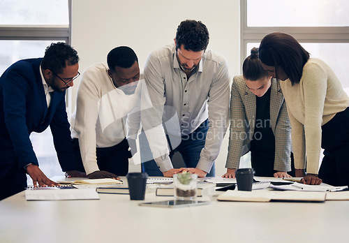 Image of Business people, paperwork and meeting in team planning, project or collaboration at the office. Group of diverse employee workers in teamwork, documents or brainstorming together at the workplace