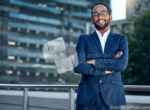 Image of Portrait, business man and lawyer with arms crossed in city for career or job. Face smile, glasses and male professional, entrepreneur or attorney from India with confidence, pride or success mindset