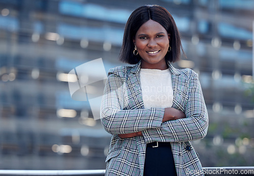 Image of Attorney portrait, black woman and arms crossed in city for business, career or job. Face, smile and female professional, entrepreneur and lawyer from South Africa with confidence and success mindset