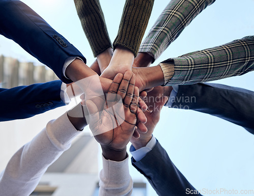 Image of Group, hands and together in circle for celebration, collaboration or people in business, company and teamwork. Businesspeople, below and celebrate success, deal or outdoor workplace team building