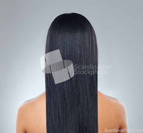 Image of Hair care, back of woman with straight hairstyle and studio backdrop with healthy keratin treatment. Long haircare, growth and style, model with beauty shine and glow on white background from behind.