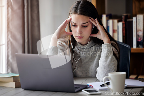Image of Laptop, headache and education with a student woman feeling burnout while studying alone in her home. Learning, stress and tired with a young female university or college pupil in her house to study