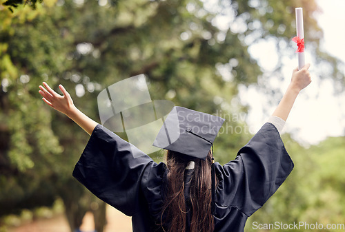 Image of Graduate, woman celebrate and degree with study diploma at event outdoor with scholarship. Certificate, back and hand holding college paper with cheer, success and motivation with achievement scroll