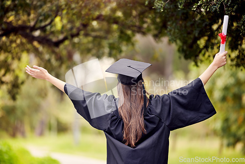 Image of Graduate, woman celebrate and open arms with degree and diploma at event outdoor with scholarship. Certificate, back and hand holding college paper with cheer, success and motivation with achievement