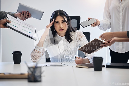 Image of Portrait, multitask and an overworked business woman at work on a laptop in her office for a deadline. Technology, burnout or stress with a young female employee feeling pressure from a busy schedule