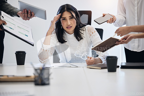 Image of Portrait, multitask and an overwhelmed business woman at work on a laptop in an office for a deadline. Technology, stress or anxiety with a young female employee feeling pressure from a busy schedule