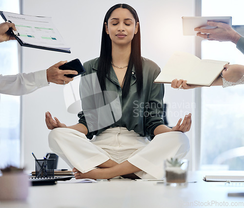 Image of Meditation, woman at desk surrounded by work and relax with project deadline, time management and mental health. Zen, peace and meditate for balance, businesswoman in busy office in lotus position.