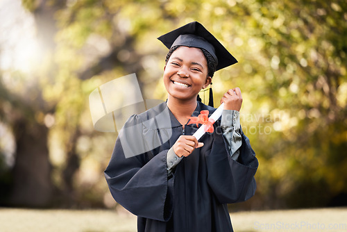 Image of Portrait, graduation or qualification with a student black woman at a university scholarship event. Education, smile or certificate with a happy female graduate standing outdoor on a college campus